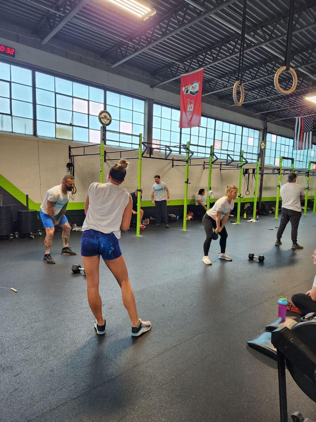 A group of people are doing exercises in a gym.
