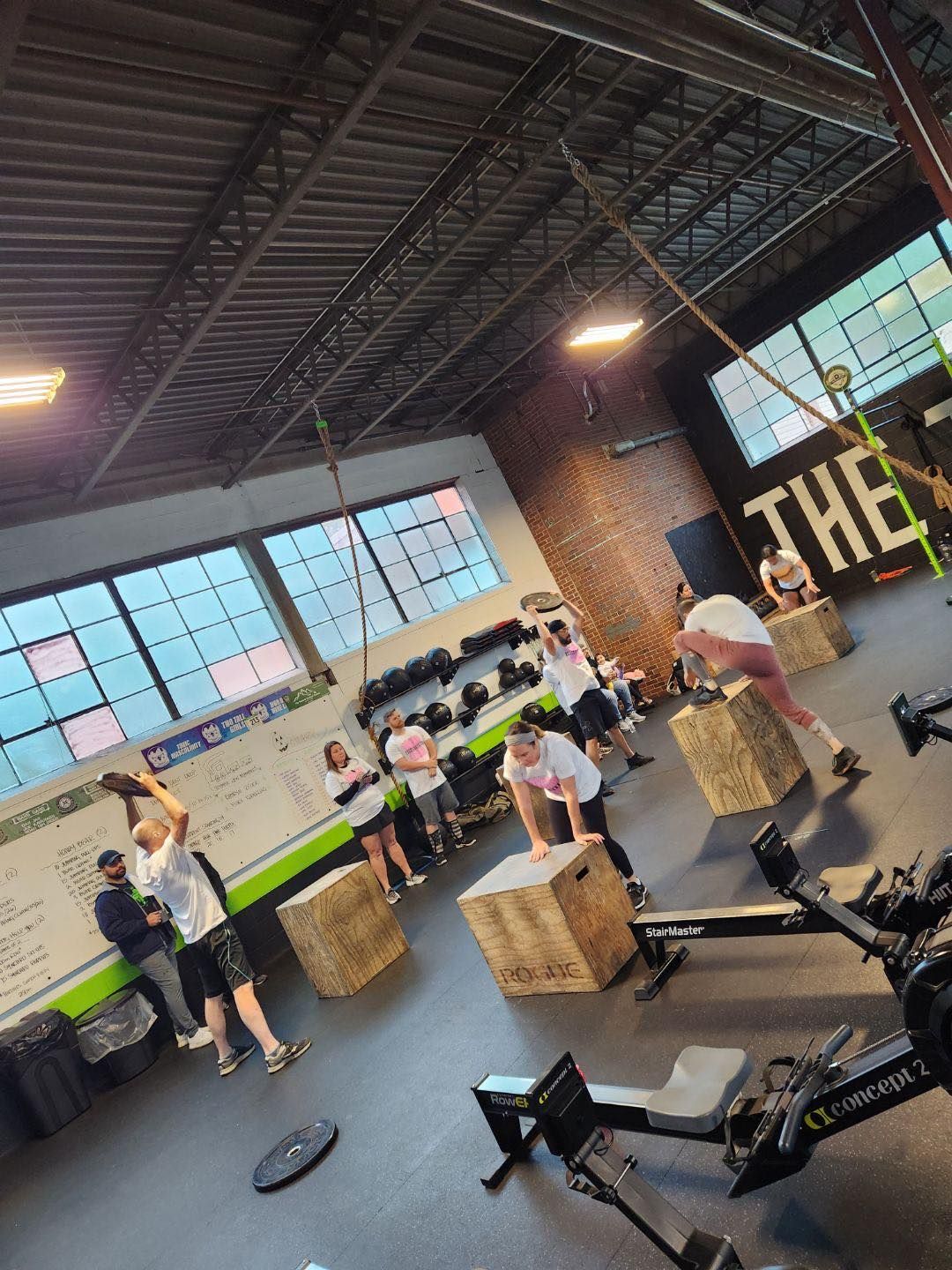 A group of people are working out in a gym.