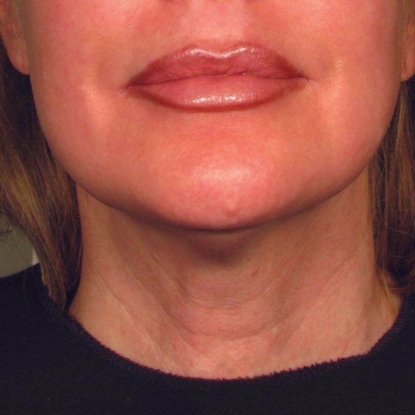 A close up of a woman 's neck and lips