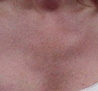 A close up of a woman 's neck and chest.