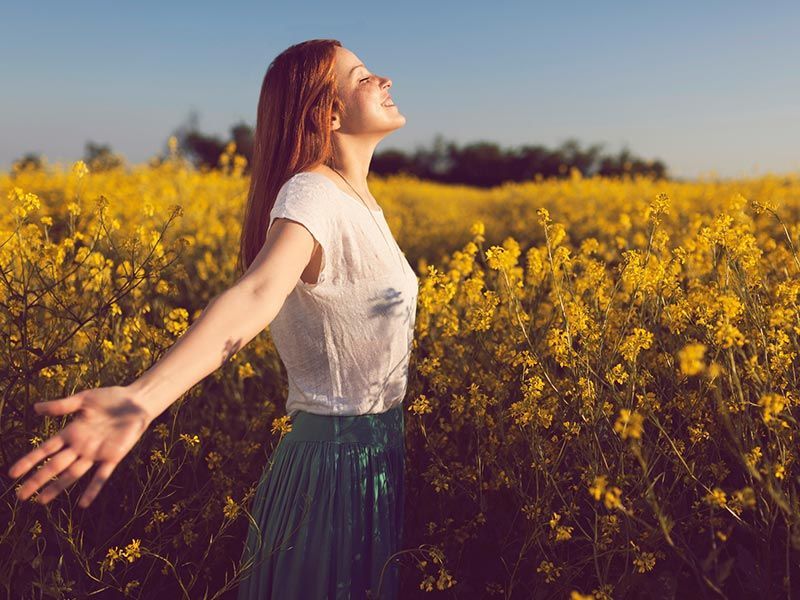 Woman Enjoying in Yellow Flower Field — Maumee, OH — Perspective Counseling Services