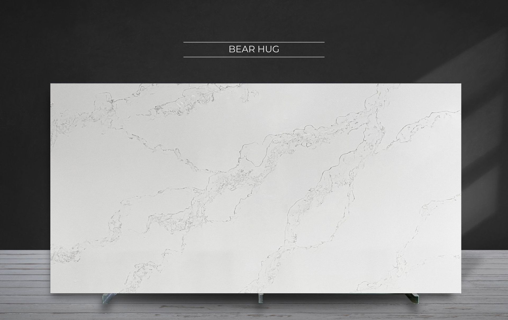 Large white marble-pattern panel on a dark wall above a light gray floor.
