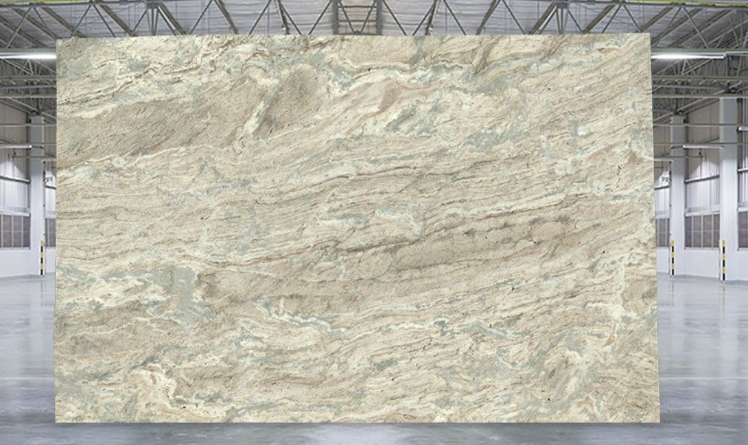 Large beige marble slab displayed in an industrial warehouse setting
