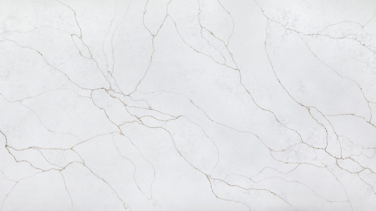 White marble surface with subtle gray veining and a smooth, clean texture