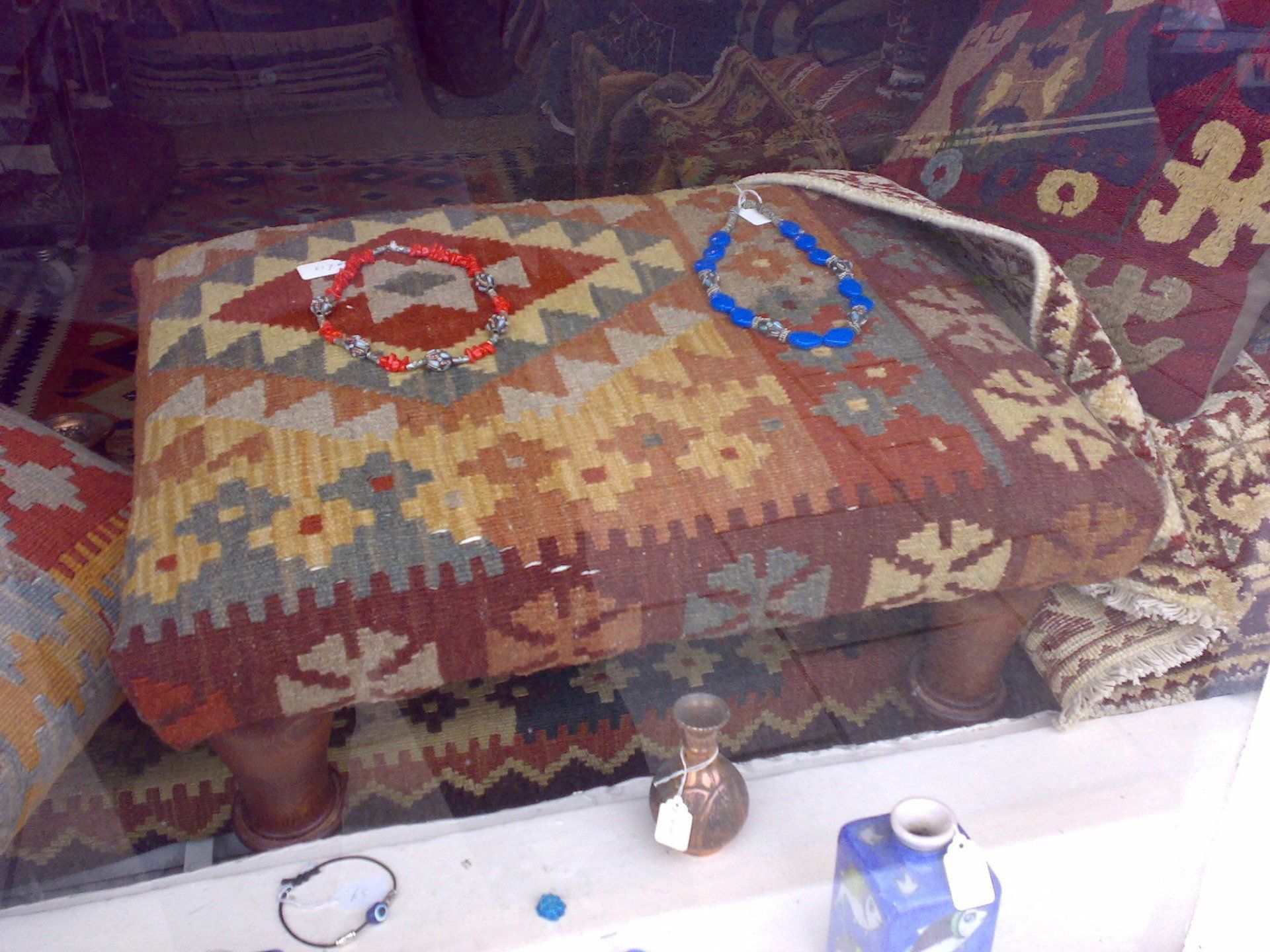Stool with Necklaces on it.