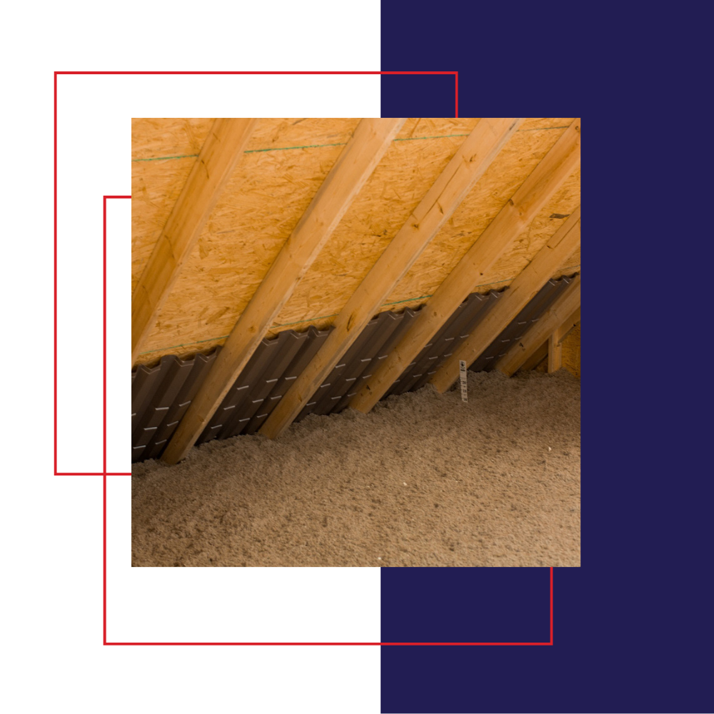 Attic with spray foam insulation, wooden beams, natural light from windows.