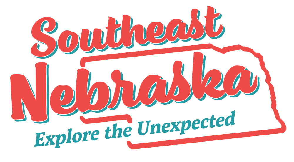 The logo for southeast nebraska explore the unexpected