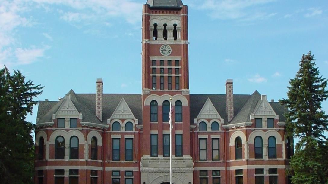 A large brick building with a clock tower on top of it