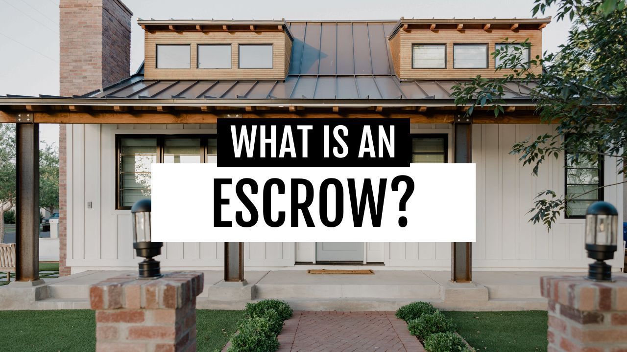 A white house with a metal roof and a sign that says what is an escrow ?