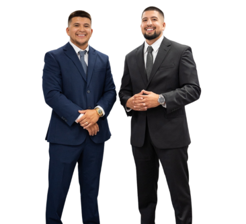 Two men in suits and ties are standing next to each other