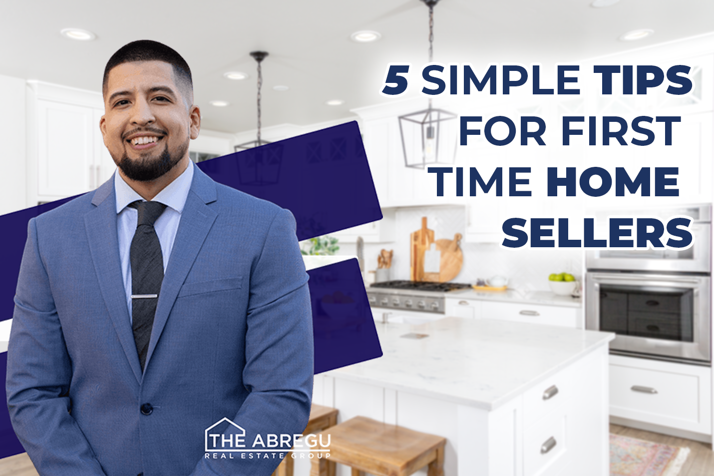 A man in a suit and tie is standing in front of a kitchen.
