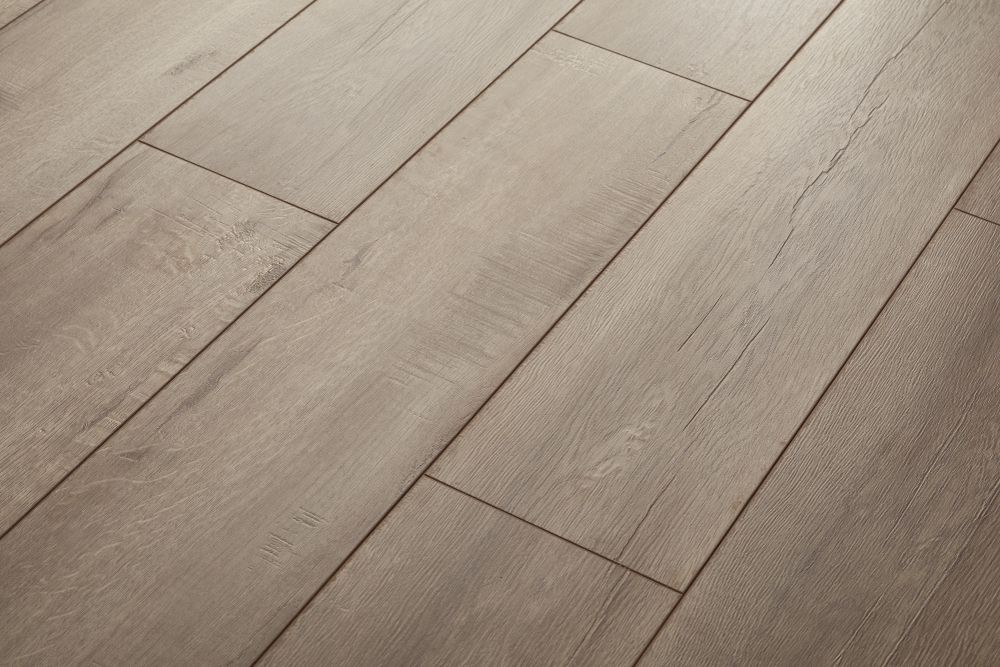 A close up of a wooden floor in a room.