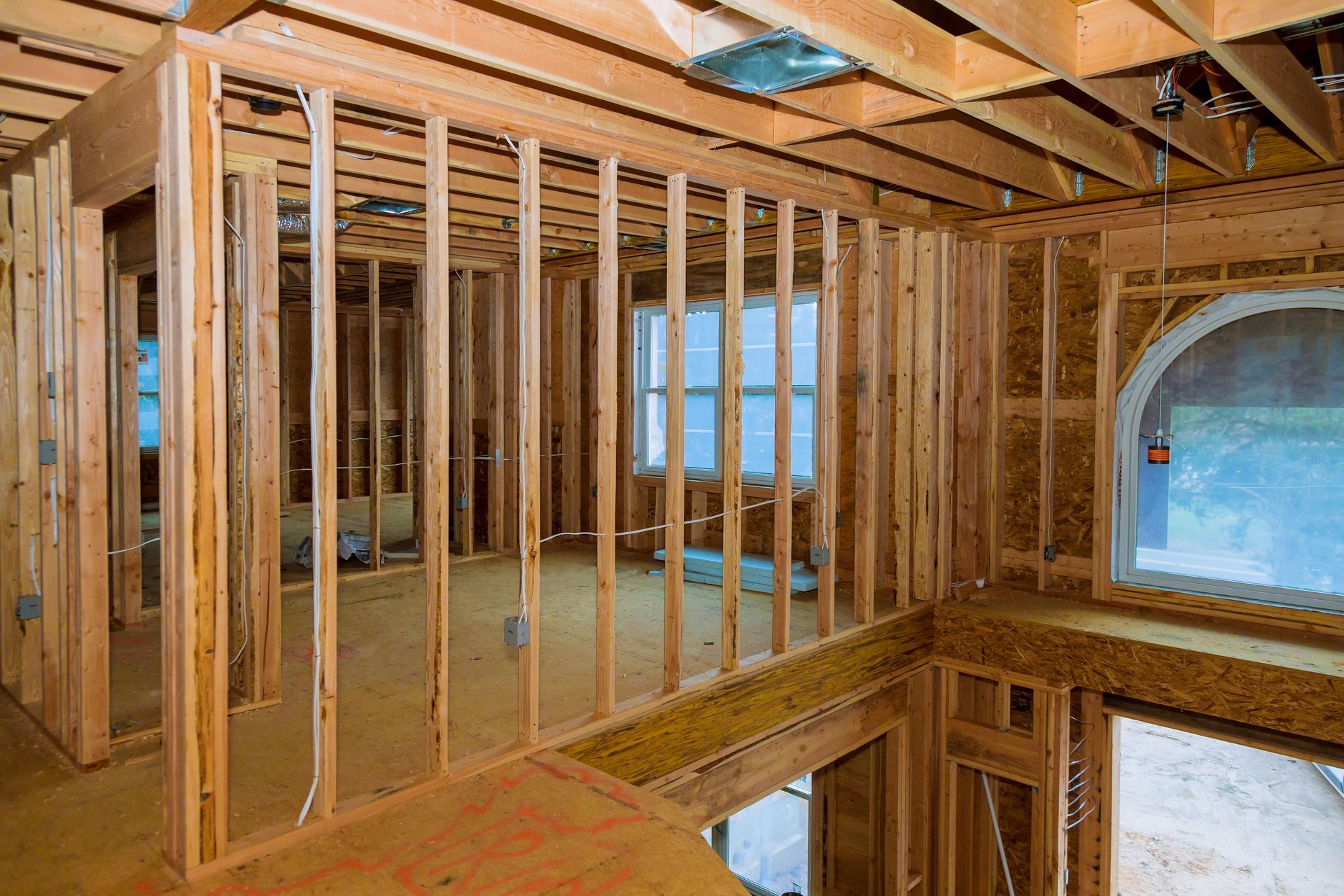 The inside of a house that is being built with wooden beams.