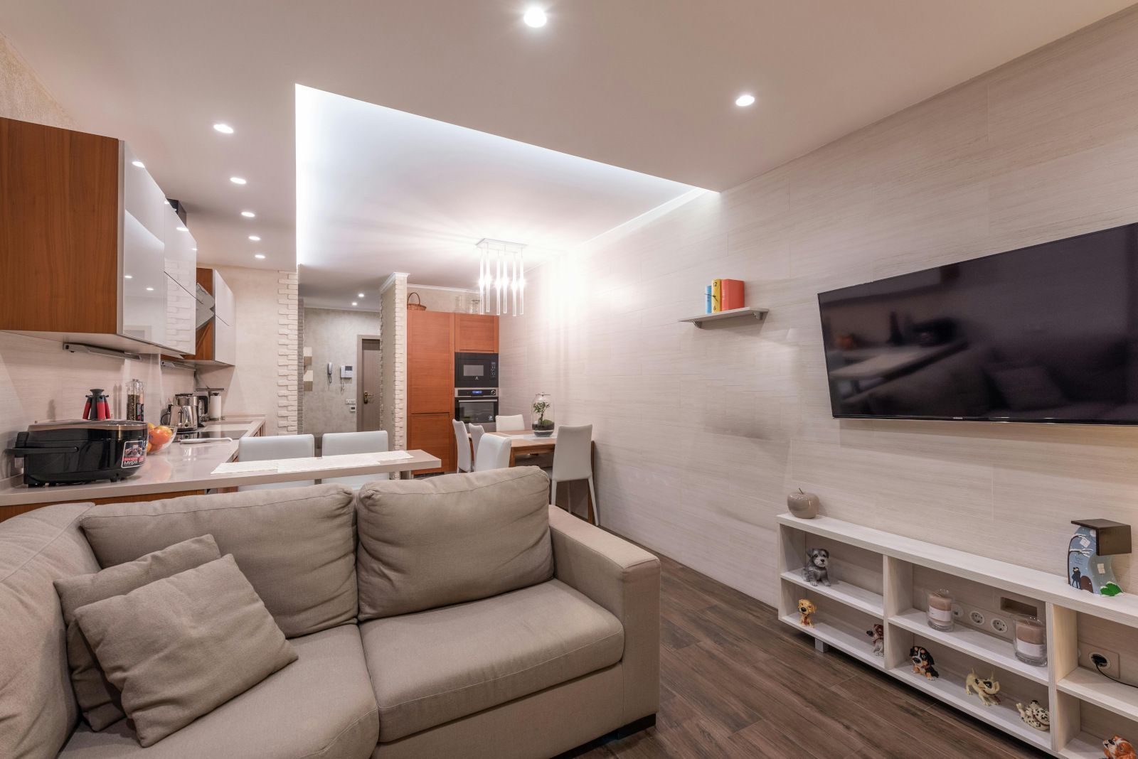A living room with a couch and a flat screen tv.