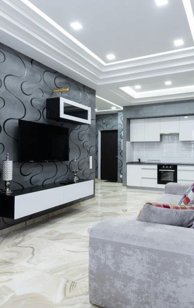 A living room with a couch and a television.