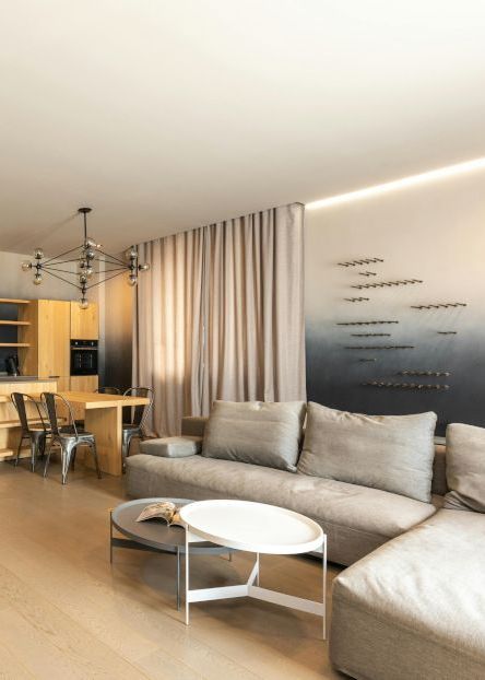 A living room with a couch , table , and television.