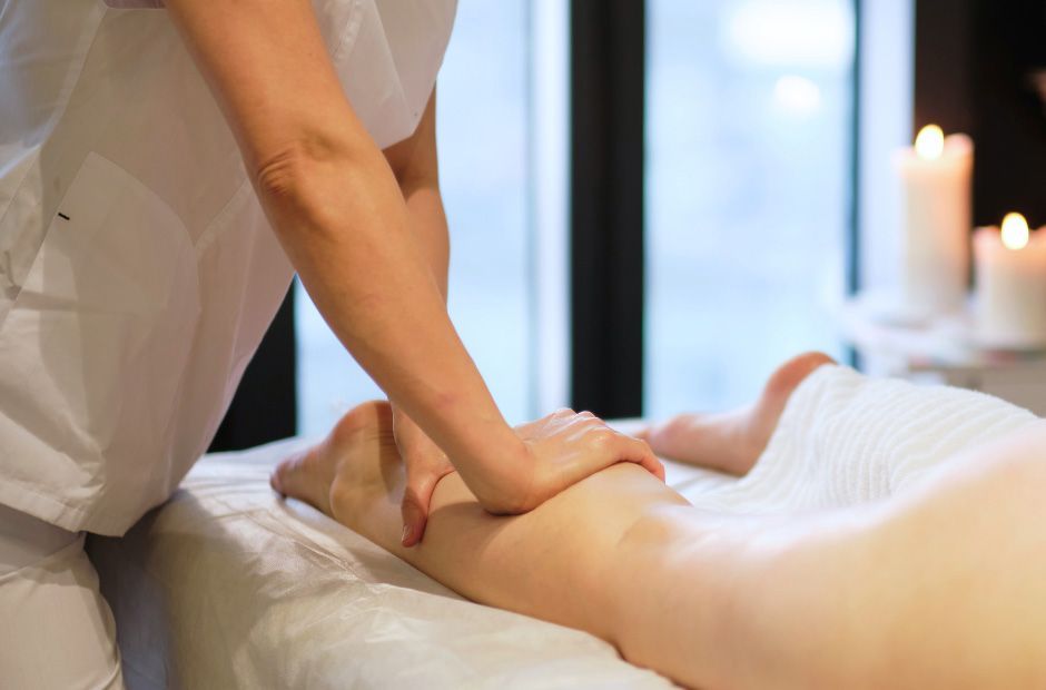 Physiotherapist Massaging Patient's Calf- Your Physio in Bundaberg, QLD