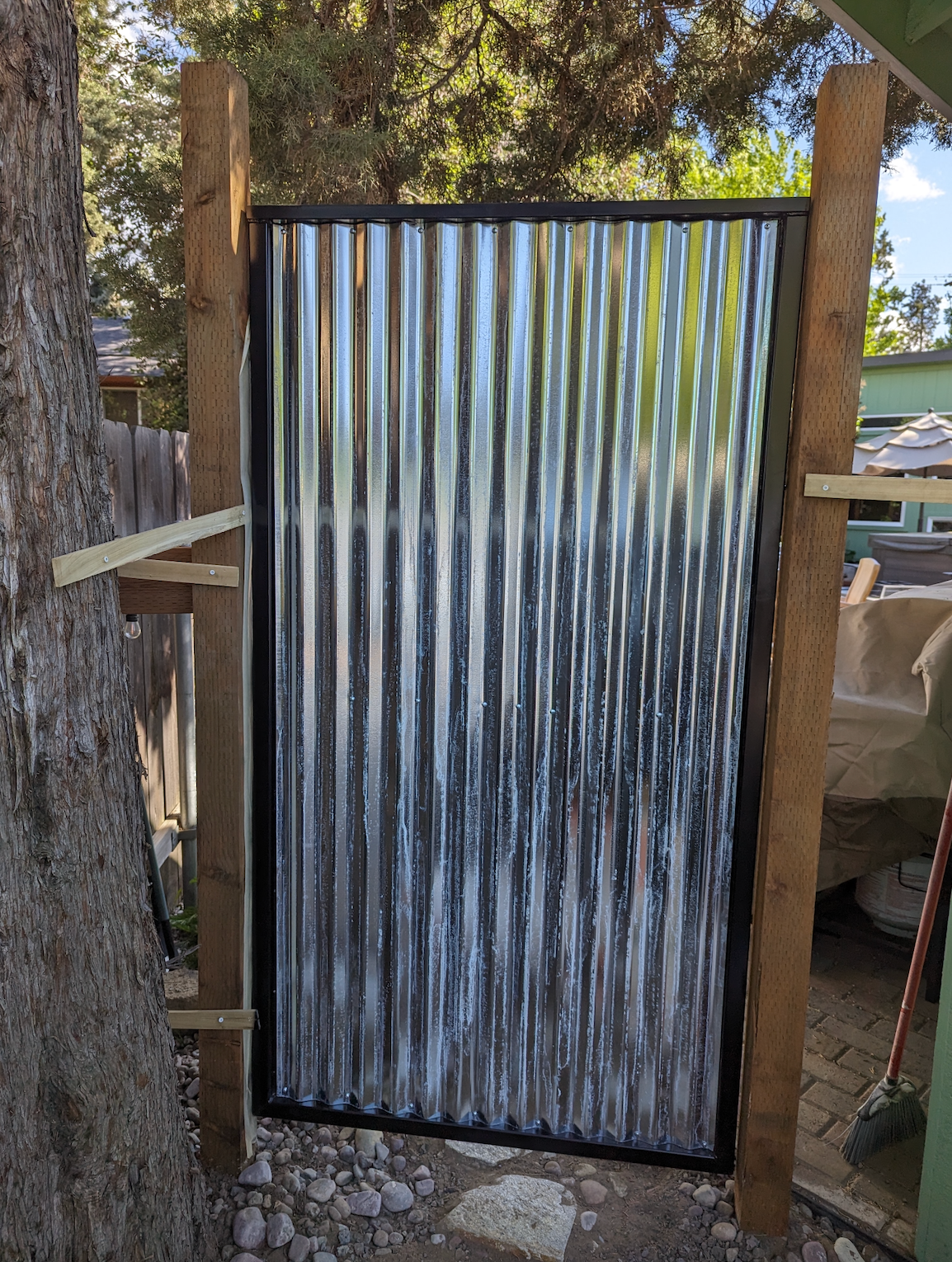 A door made out of corrugated metal and wood