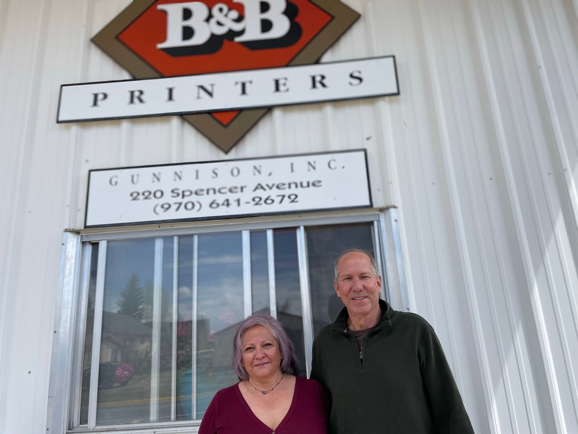 Two people stand in front of 