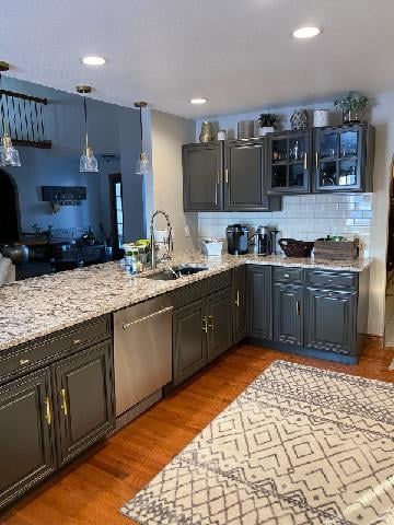 A kitchen with gray cabinets , granite counter tops , stainless steel appliances and a rug - Luther Falls Kitchen & Bath - Champaign, IL