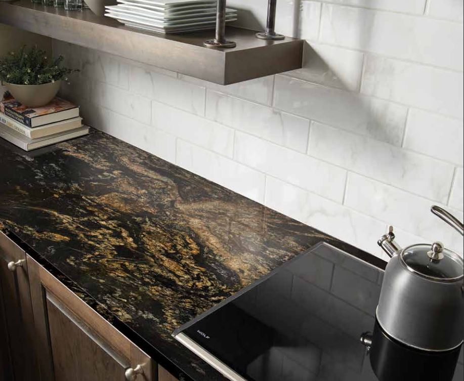 A kitchen with a black counter top and a black stove top oven - Luther Falls Kitchen & Bath - Champaign, IL
