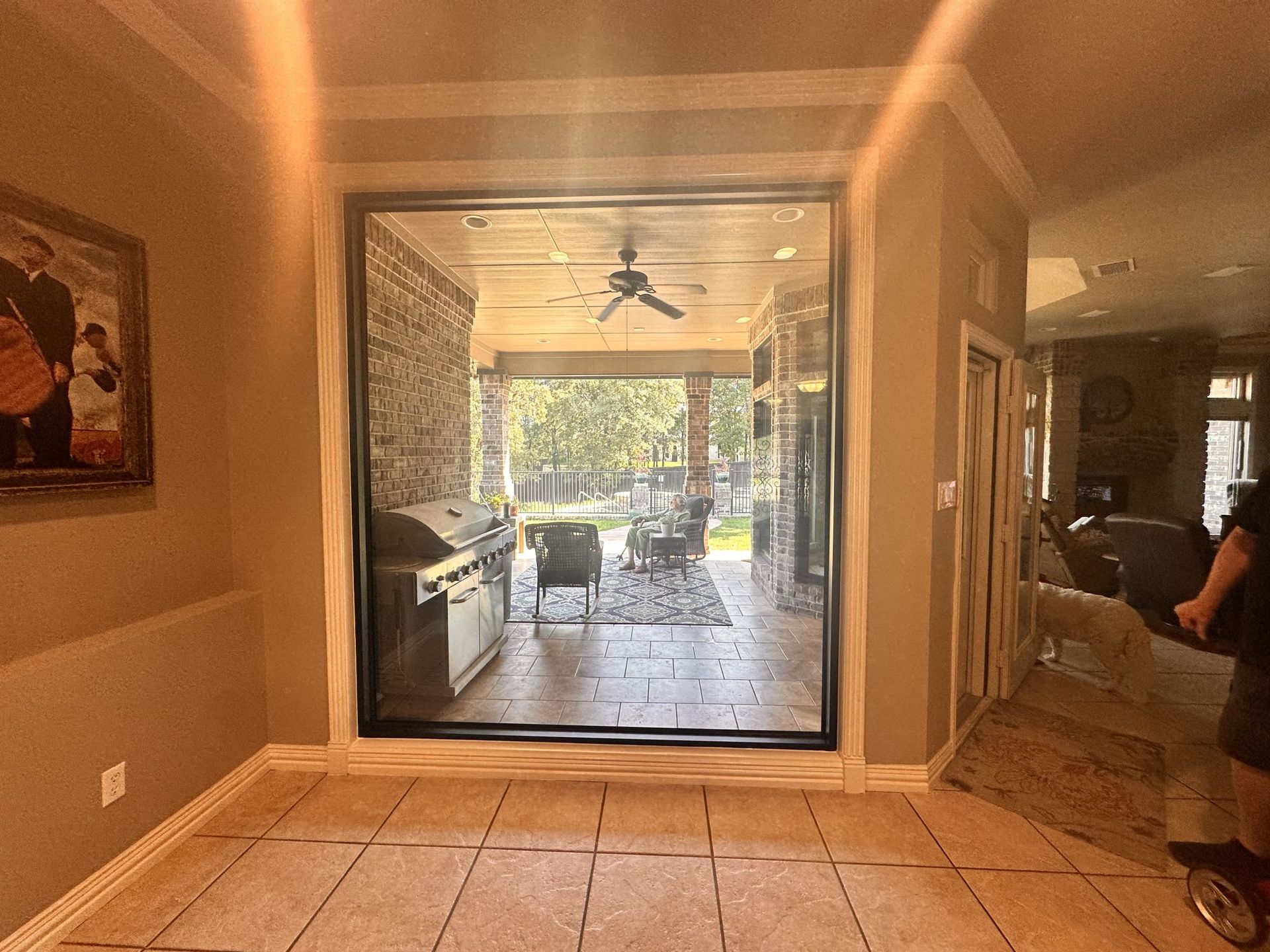 A room with a sliding glass door leading to a patio.