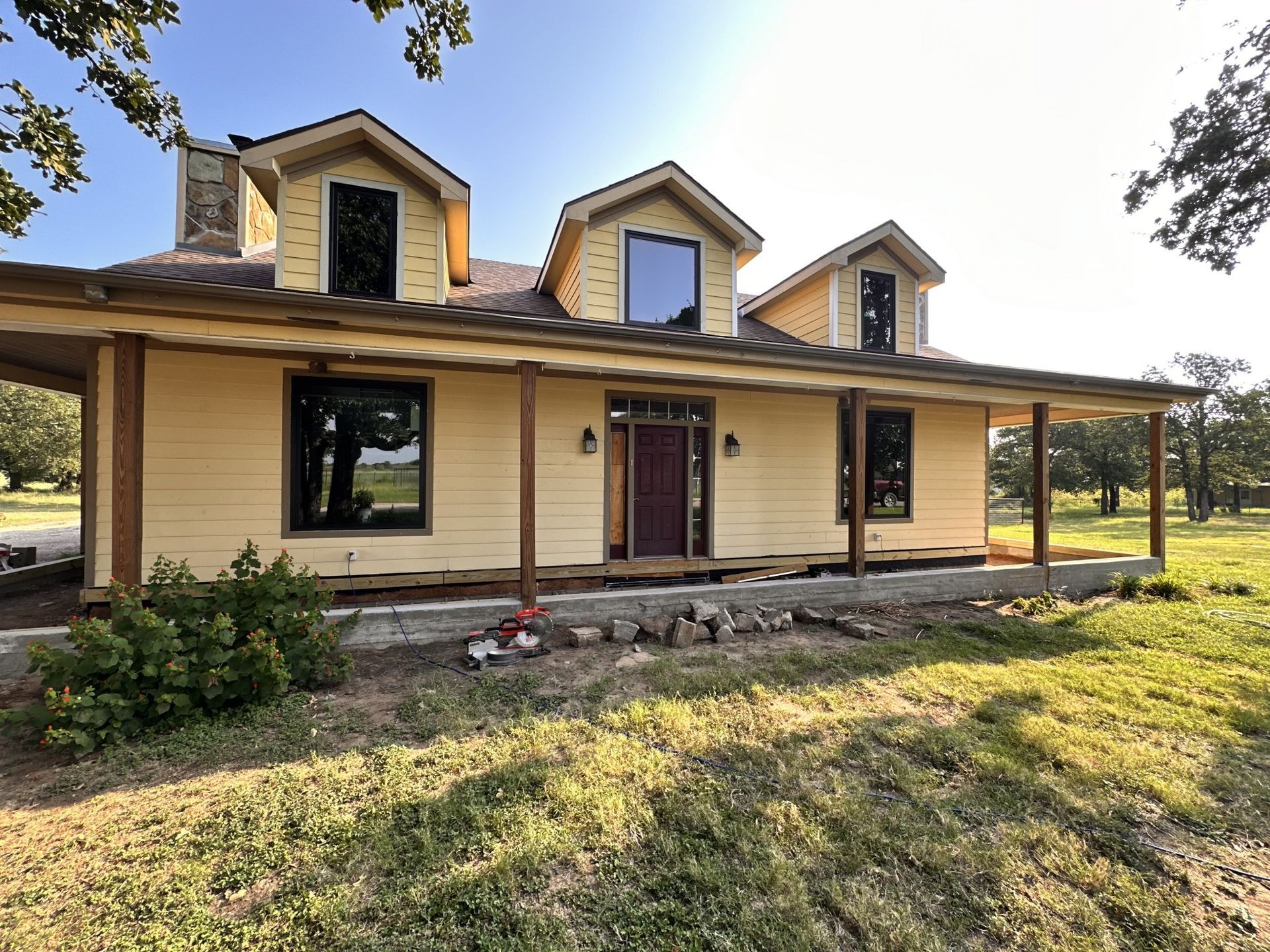 A large house with a porch and a lot of windows
