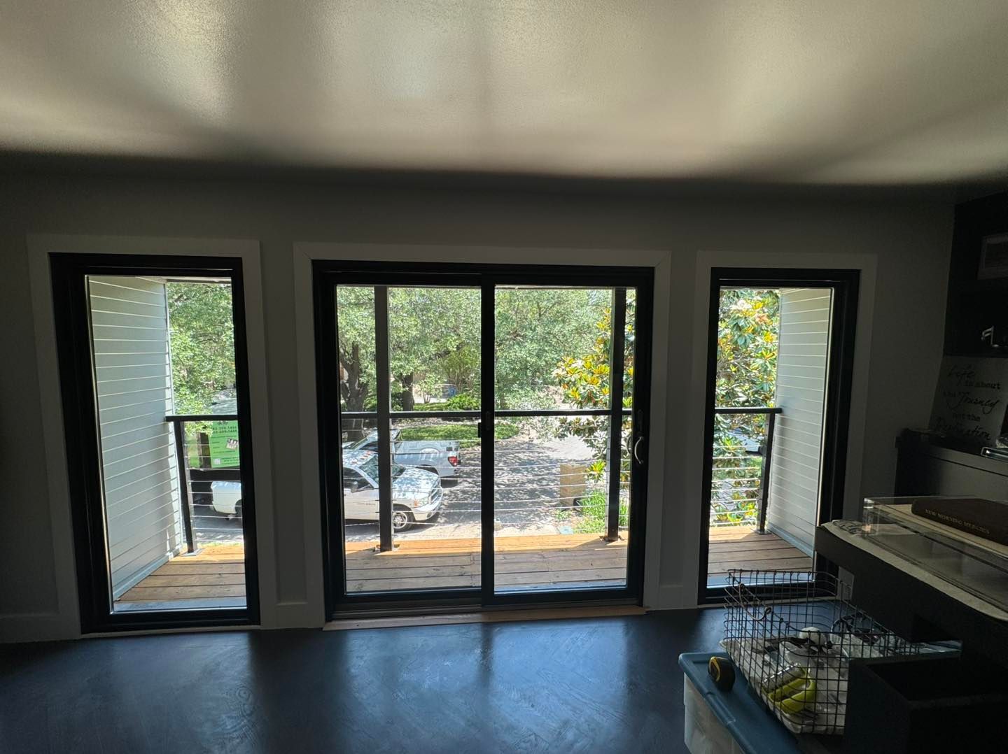 A living room with sliding glass doors leading to a balcony.