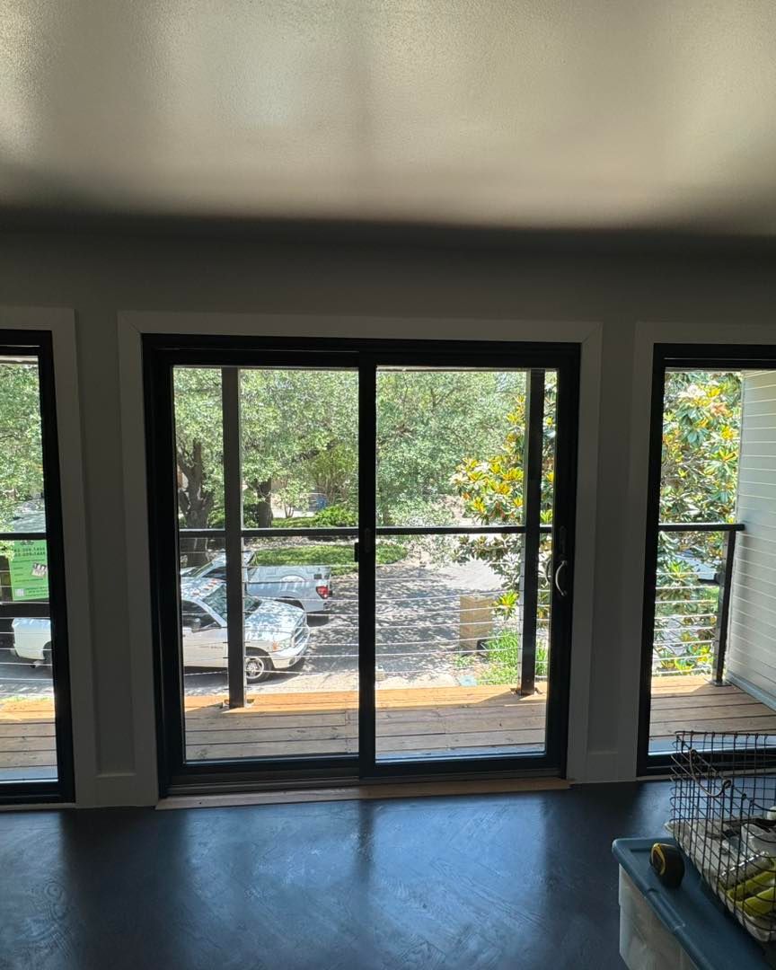 A living room with sliding glass doors leading to a deck.