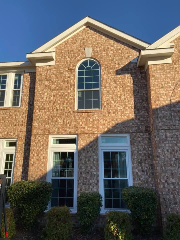 A large brick house with a lot of windows
