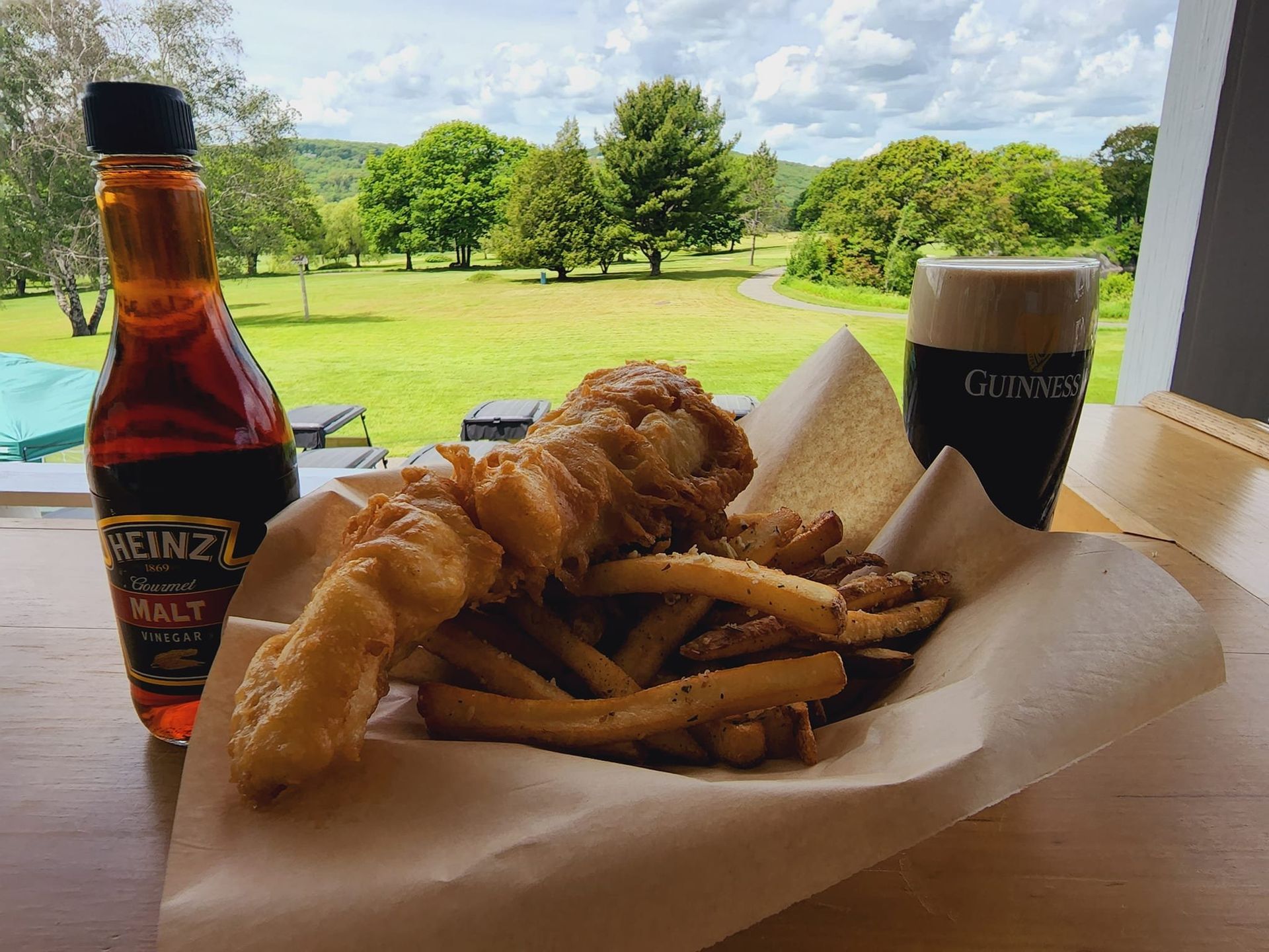 Fish and chips served at Mulligan’s overlooking the course at Rockland Golf Club.