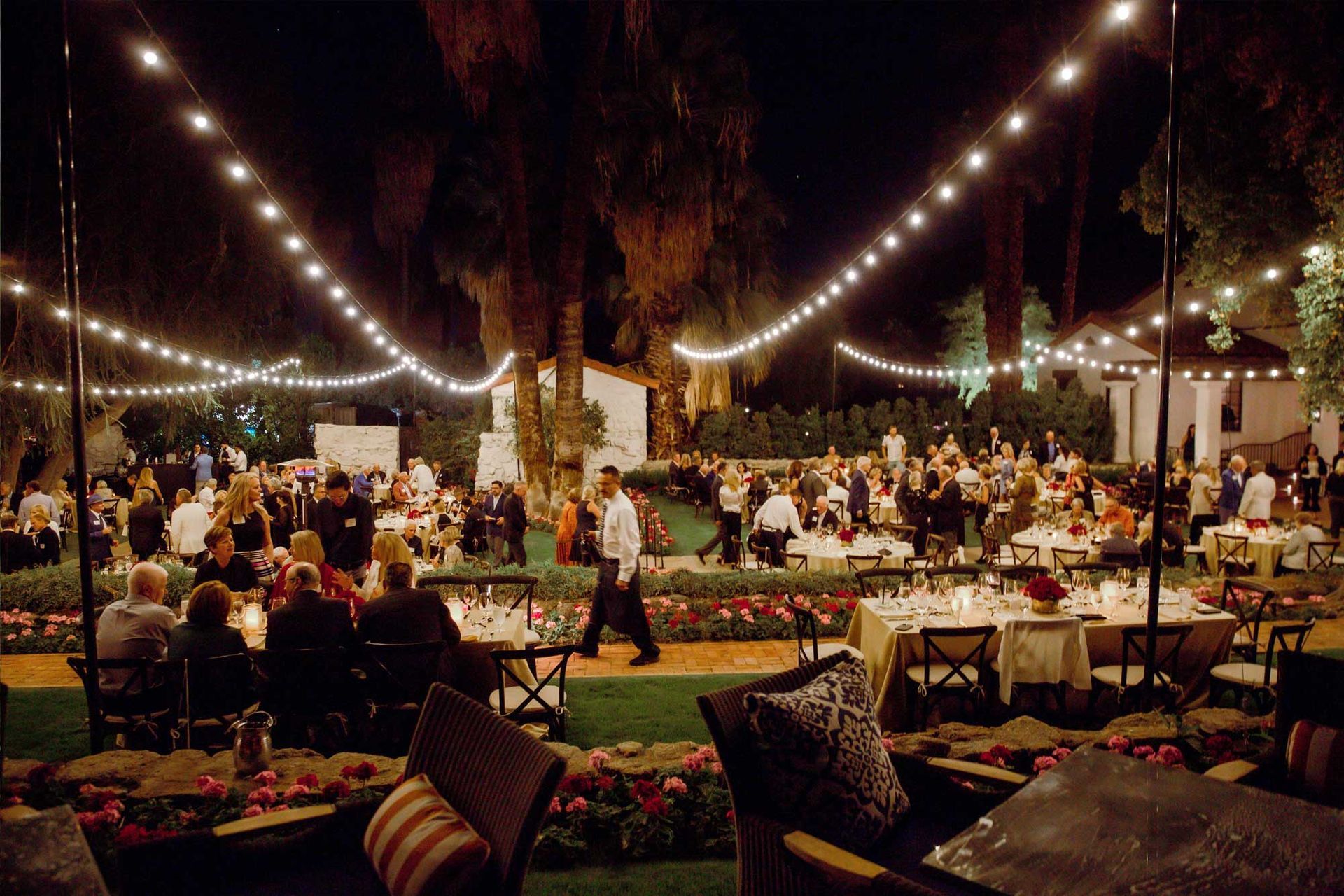 Elegant nighttime gathering and celebration at golf club social event.