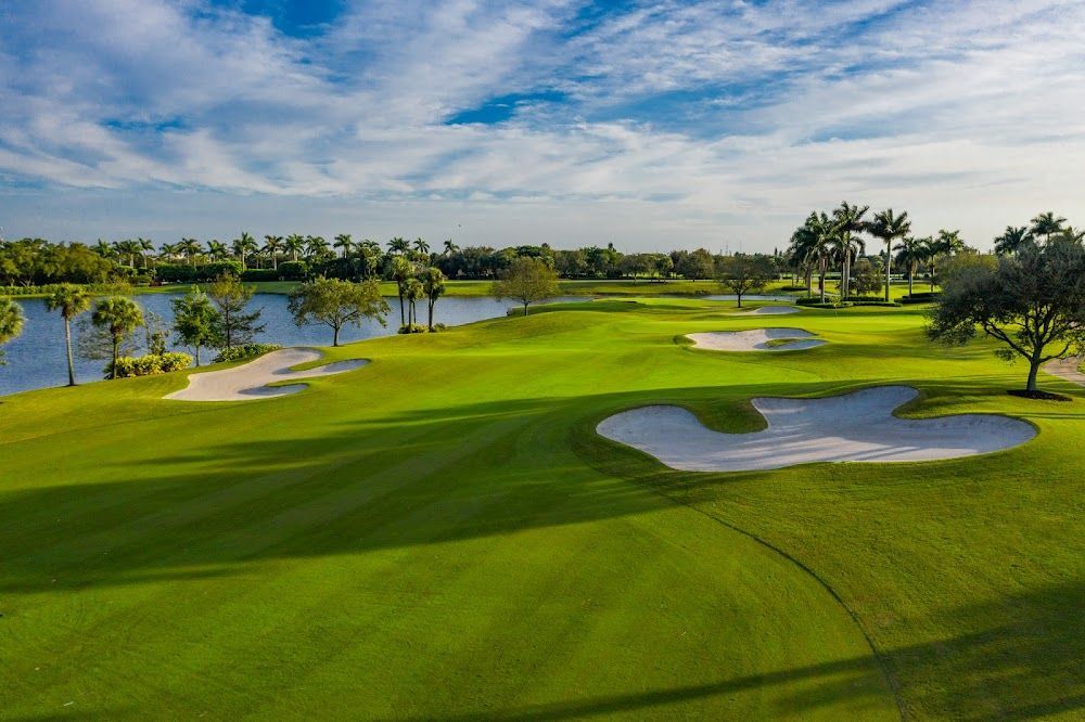 Scenic golf hole managed by powerful golf management system with online tee time reservation and course scheduling tools.
