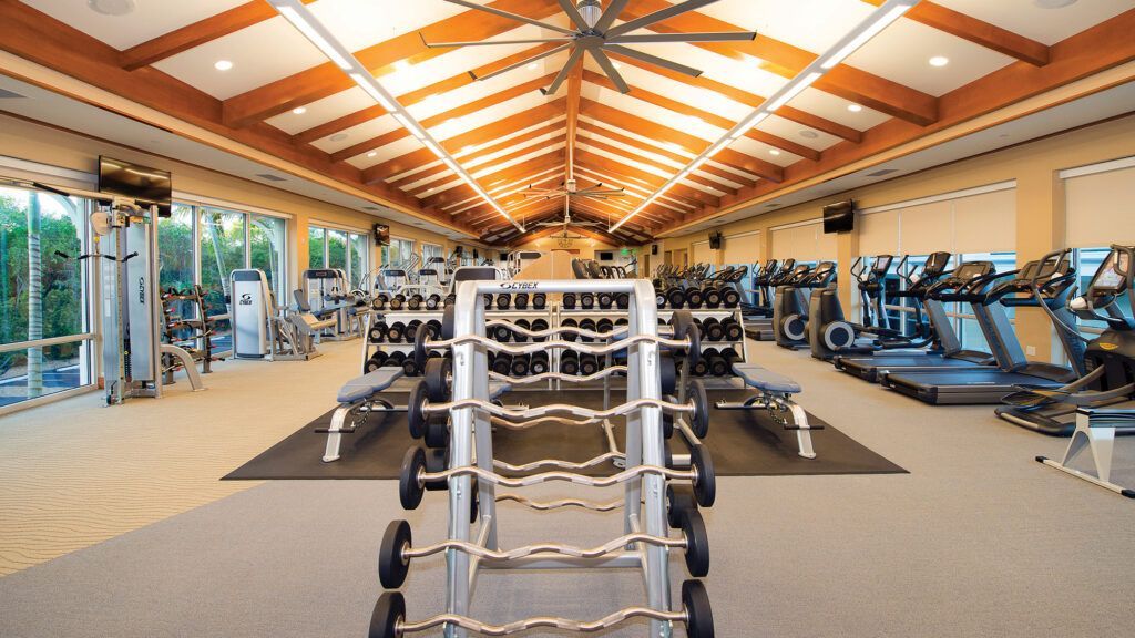 Luxury wellness and fitness center at a premier golf club, emphasizing the integration of health-focused amenities in modern clubhouse design.