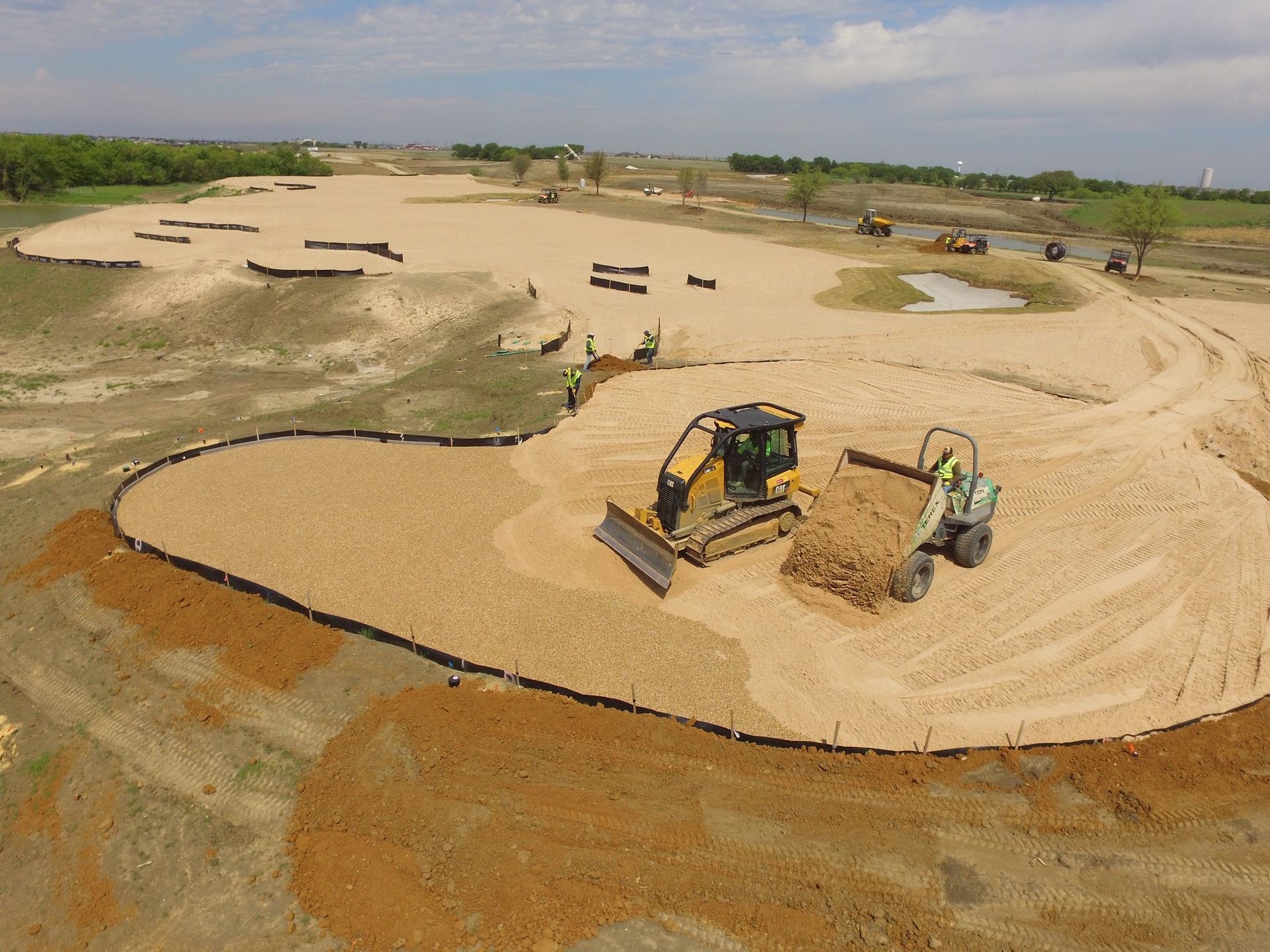 New golf course development showing early land grading and site preparation in progress.