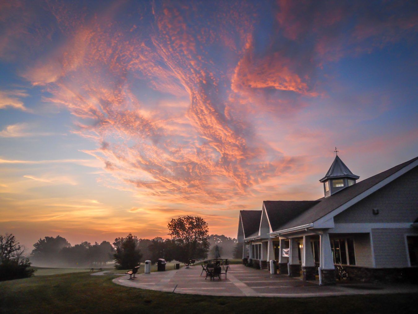 Exterior view of the clubhouse at Charlie Vettiner Golf Course in Louisville, Kentucky on a clear morning.