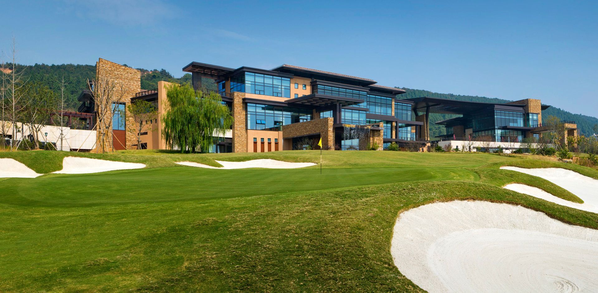 Modern golf clubhouse with sleek architecture and open layout reflecting new trends in club design.