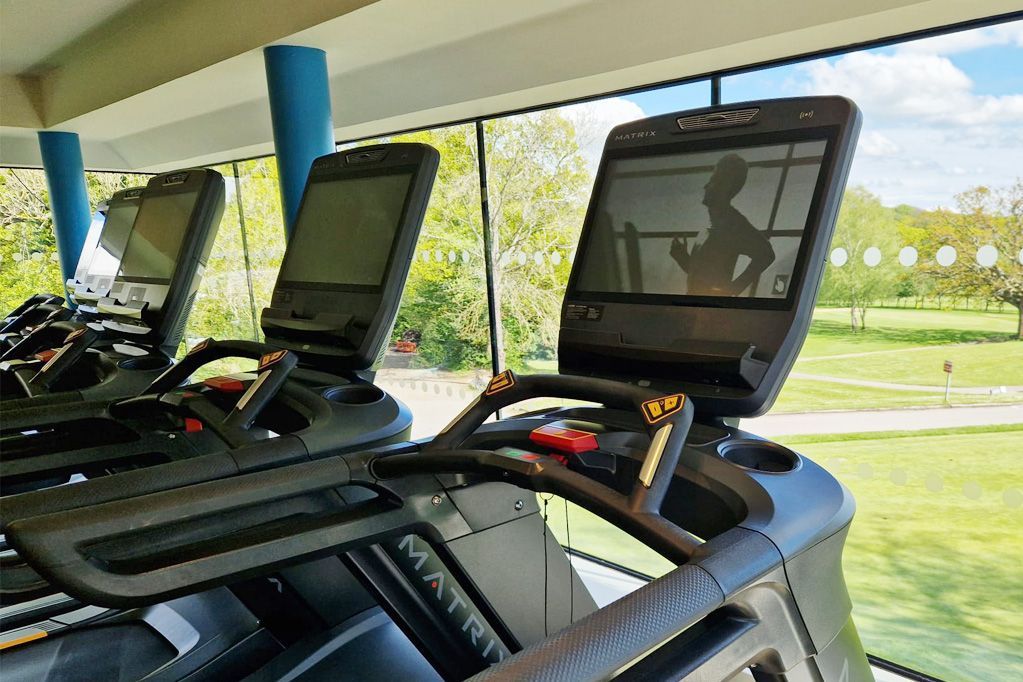 Golf fitness and wellness center with panoramic course views – integrating health and lifestyle at modern golf clubs.