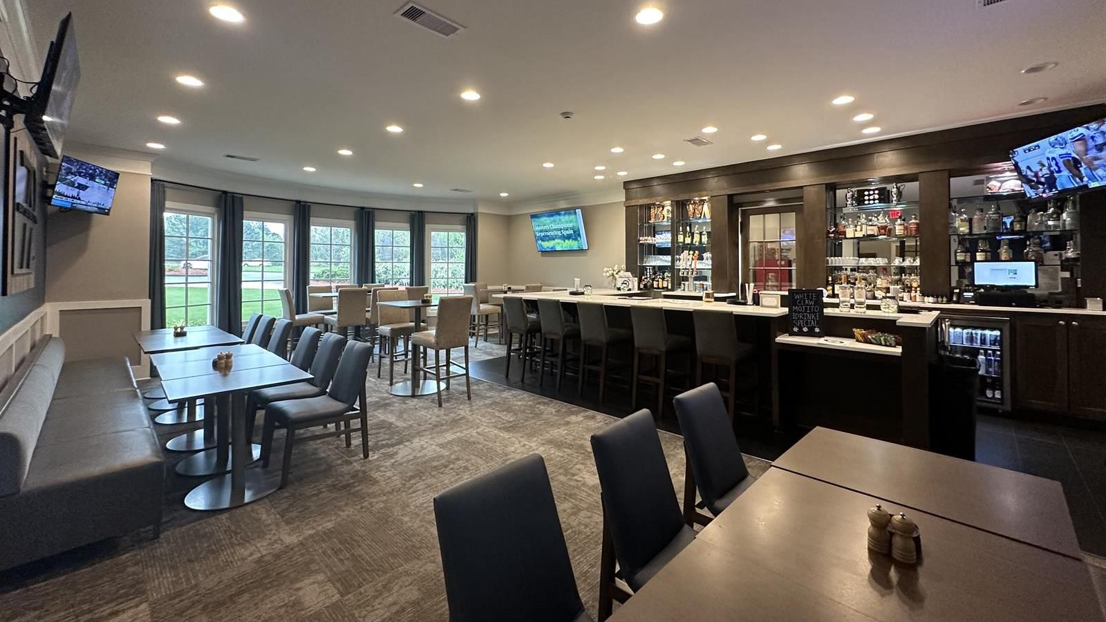 Clubhouse restaurant interior with bar seating, offering golfers a place to relax post-round.