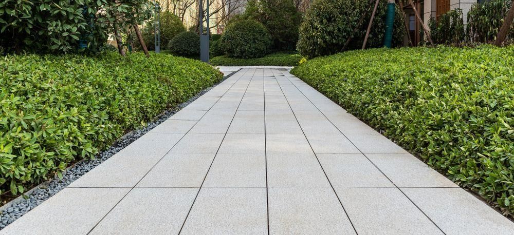 A Brick Walkway Surrounded by Trees and Bushes in a Park — The Brick Paving Centre in Winnellie, NT