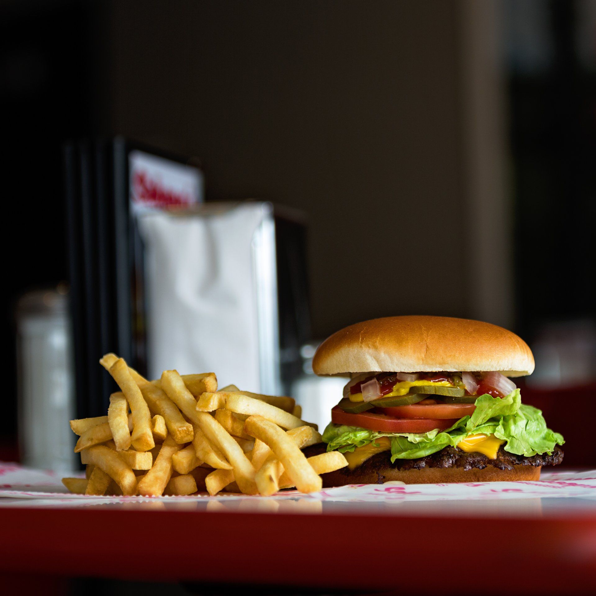 A hamburger and french fries are on a table