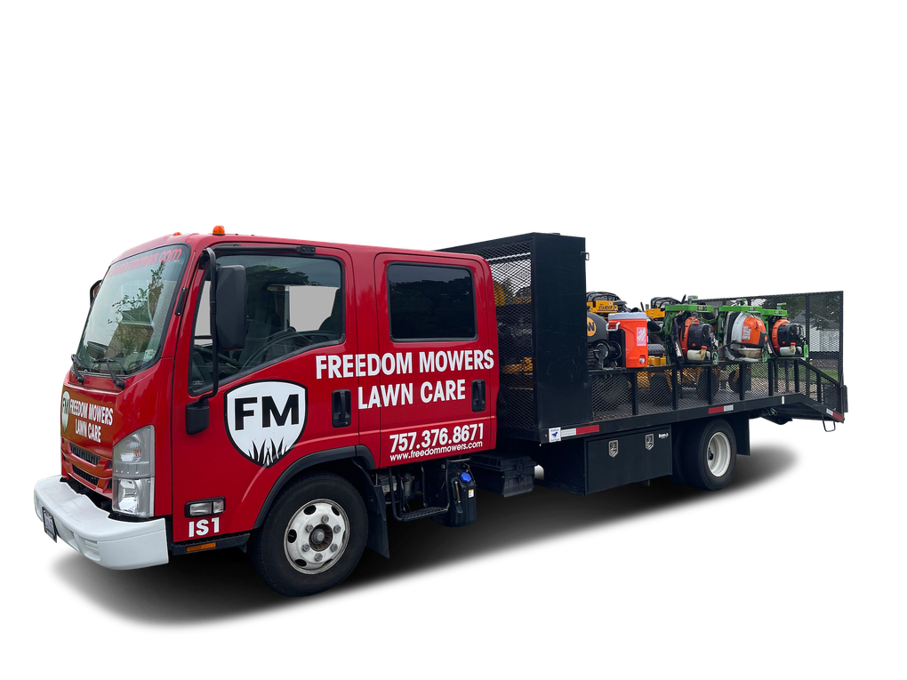 A red truck with the word freedom on the side is parked on a white background.