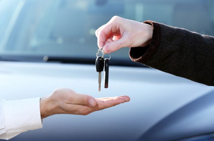 man handing the car keys