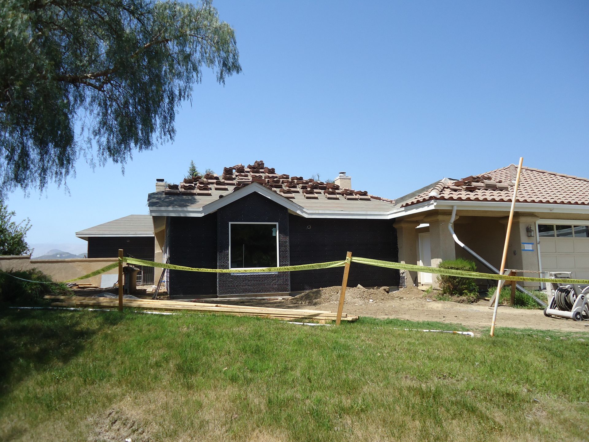 image of the front of a house   During Construction, roofing in process, 2 bedrooms, 1 bathroom  Home Addition, Thousand Oaks, CA 