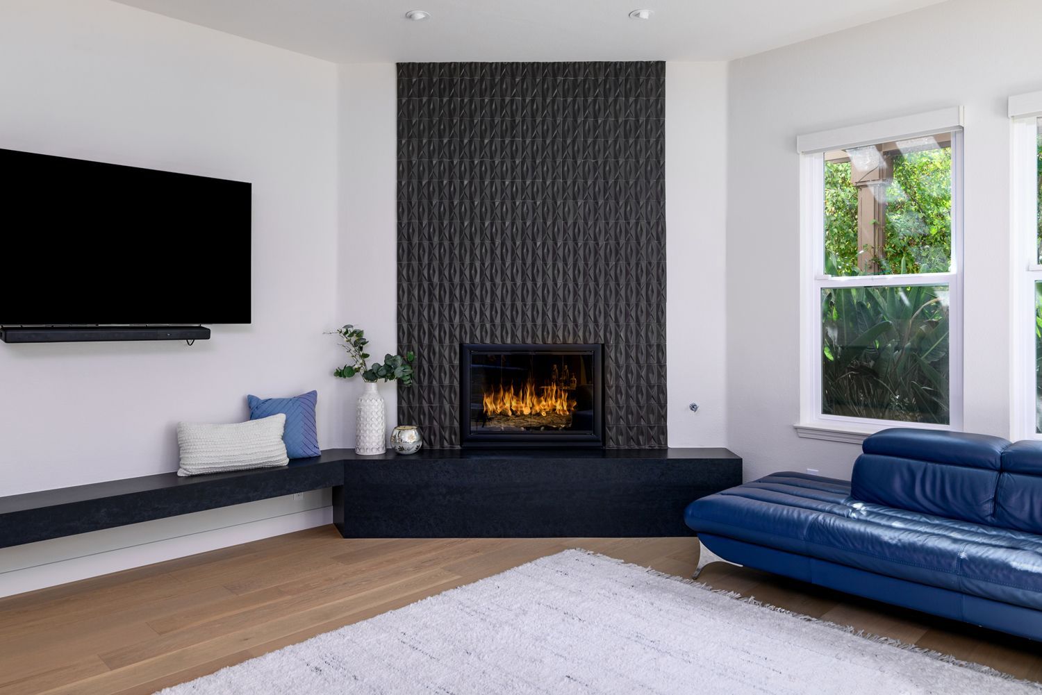 Fireplace Remodel with black geometric textured tile and black quartz hearth, Thousand Oaks, CA 