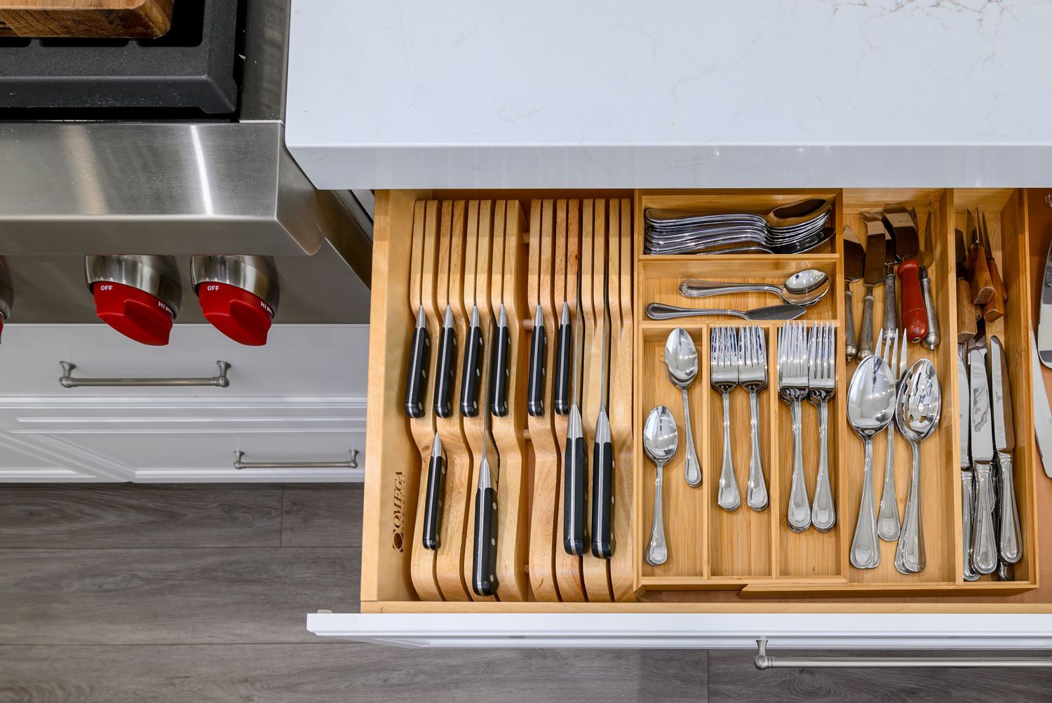 image of an open utility drawer, customized kitchen storage, Thousand Oaks, CA, kitchen remodel,  