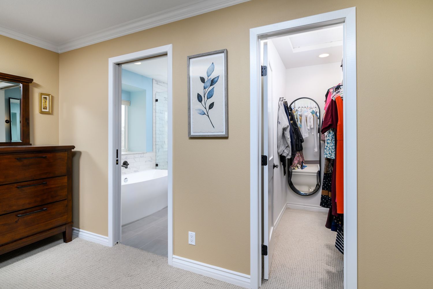 image of a bedroom with a view to a walk-in closet and a bathroom, Oak Park, CA primary bathroom addition and remodel 