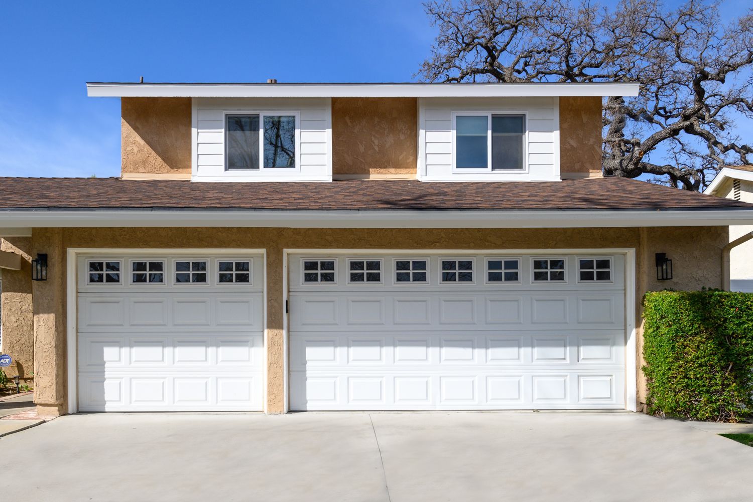 image of the outside of a house with two new bay windows on the second story, window installation, window replacement, Oak Park, CA, home remodel 