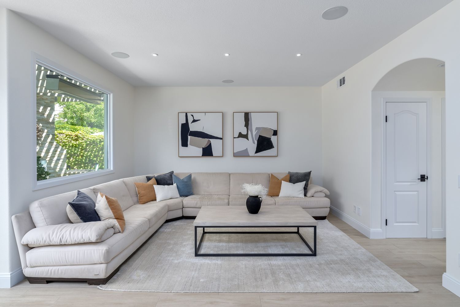 image of a modern style living room with white walls, a linen colored rug, couch and table, Rancho Conejo Community, Newbury Park, Home Remodel, Living Room Remodel