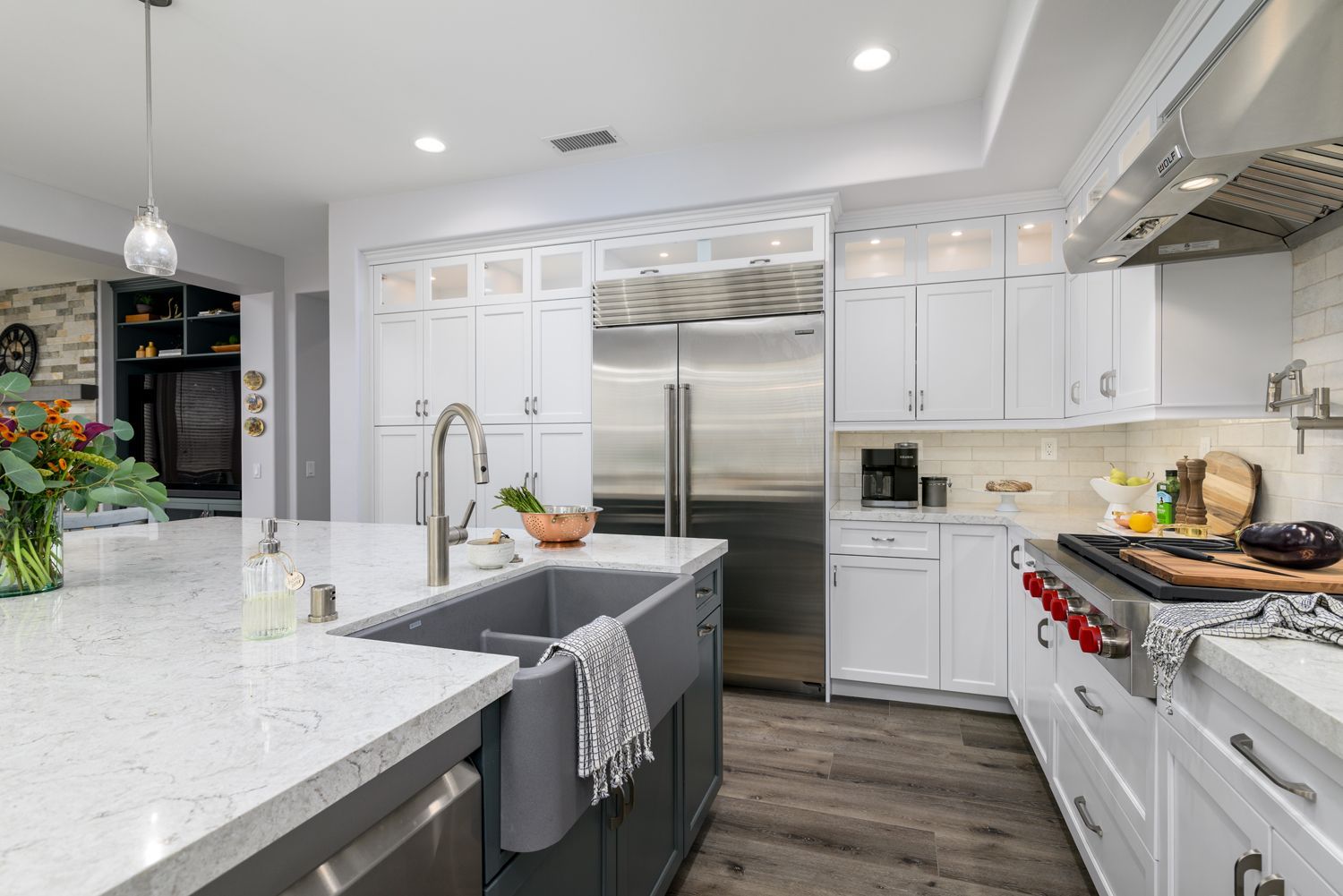 Apron Farm House Sink in kitchen island, white perimeter cabinetry in Thousand Oaks Transitional Kitchen Remodel 